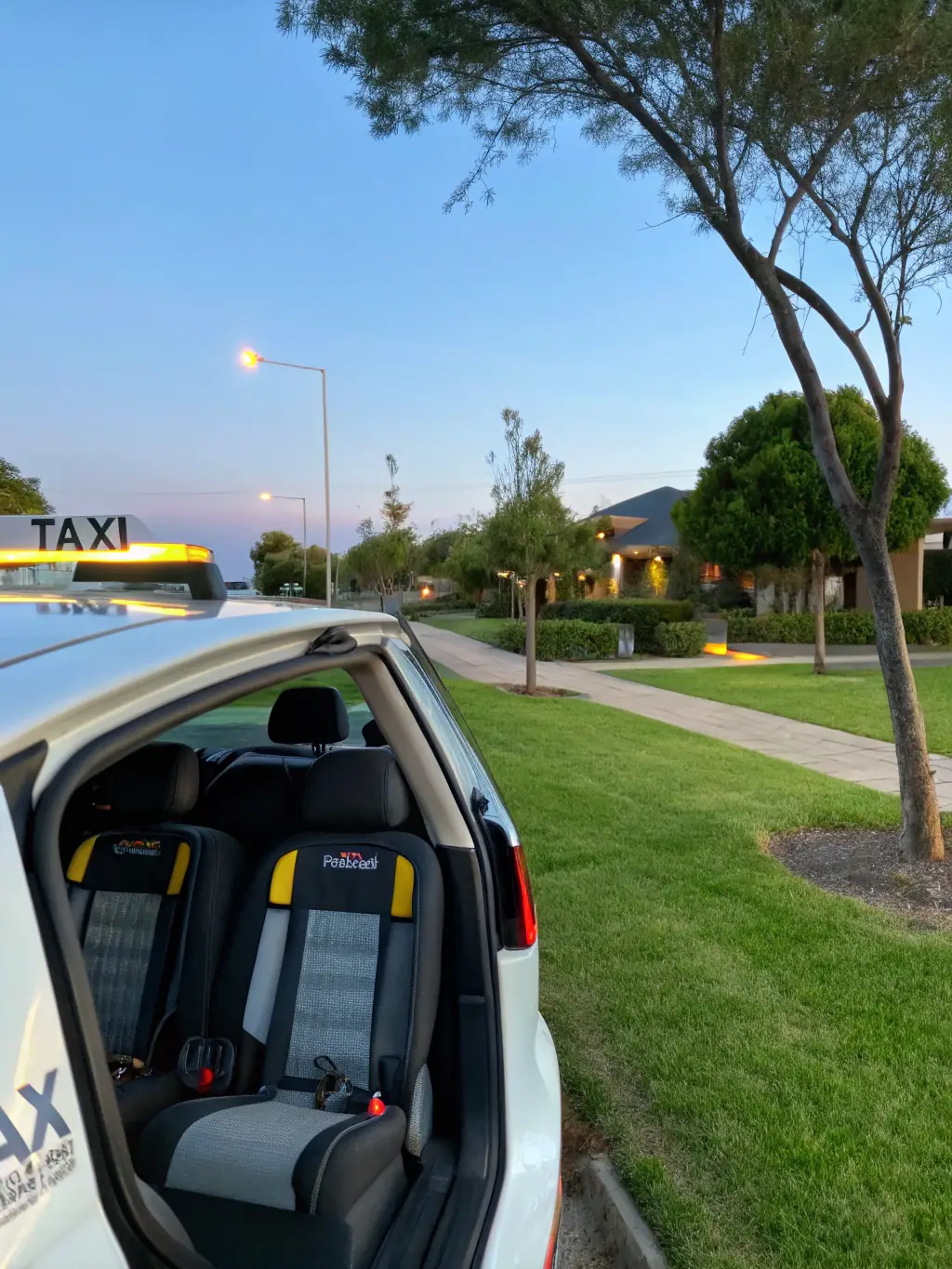 An image of a Fast Lane Dispatch taxi equipped with child safety seats, emphasizing the company's commitment to family-friendly services.